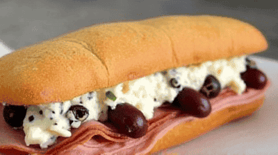 Muffuletta Sandwich New OrleansStyle with Olive Salad Cold Cuts  Provolone